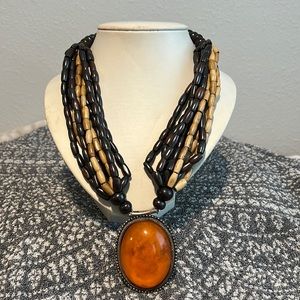 Wooden necklaces with orange pendant